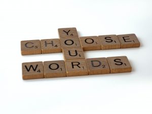 Scrabble tiles spelling Choose Your Words