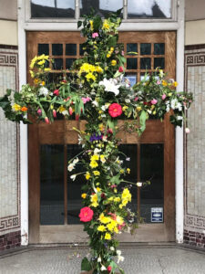 A flower arrangement in the shape of the Cross