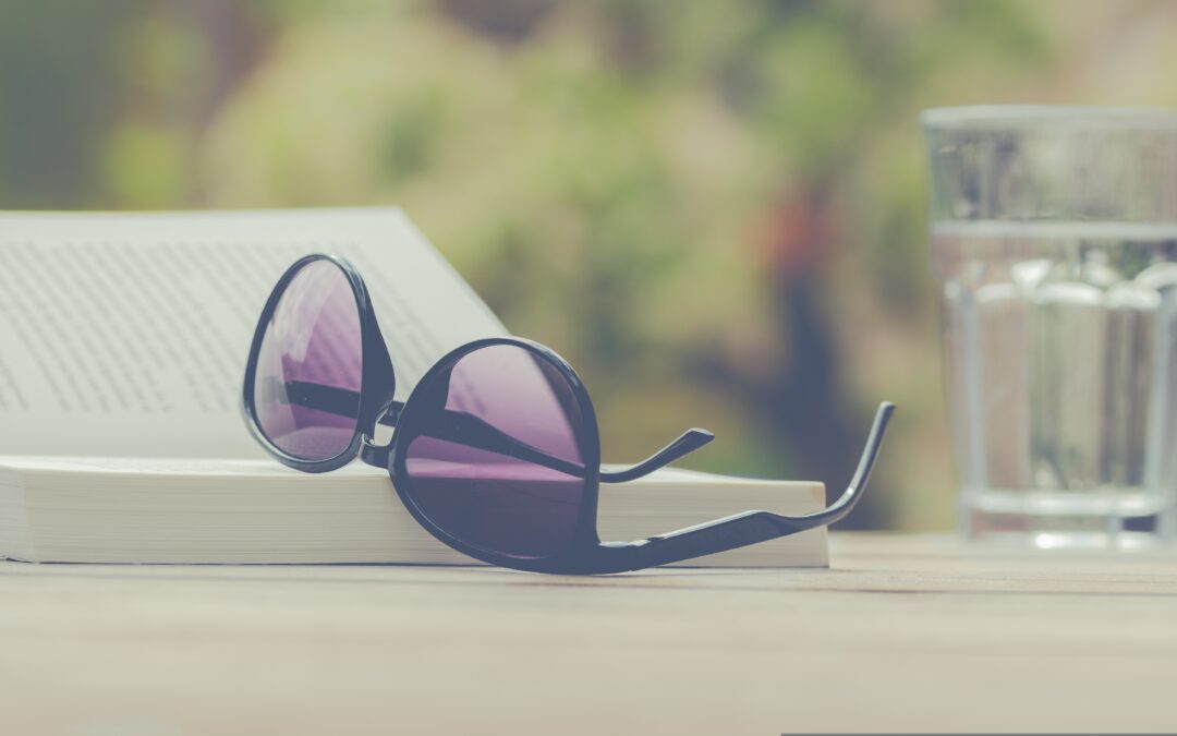 Glasses beside open book