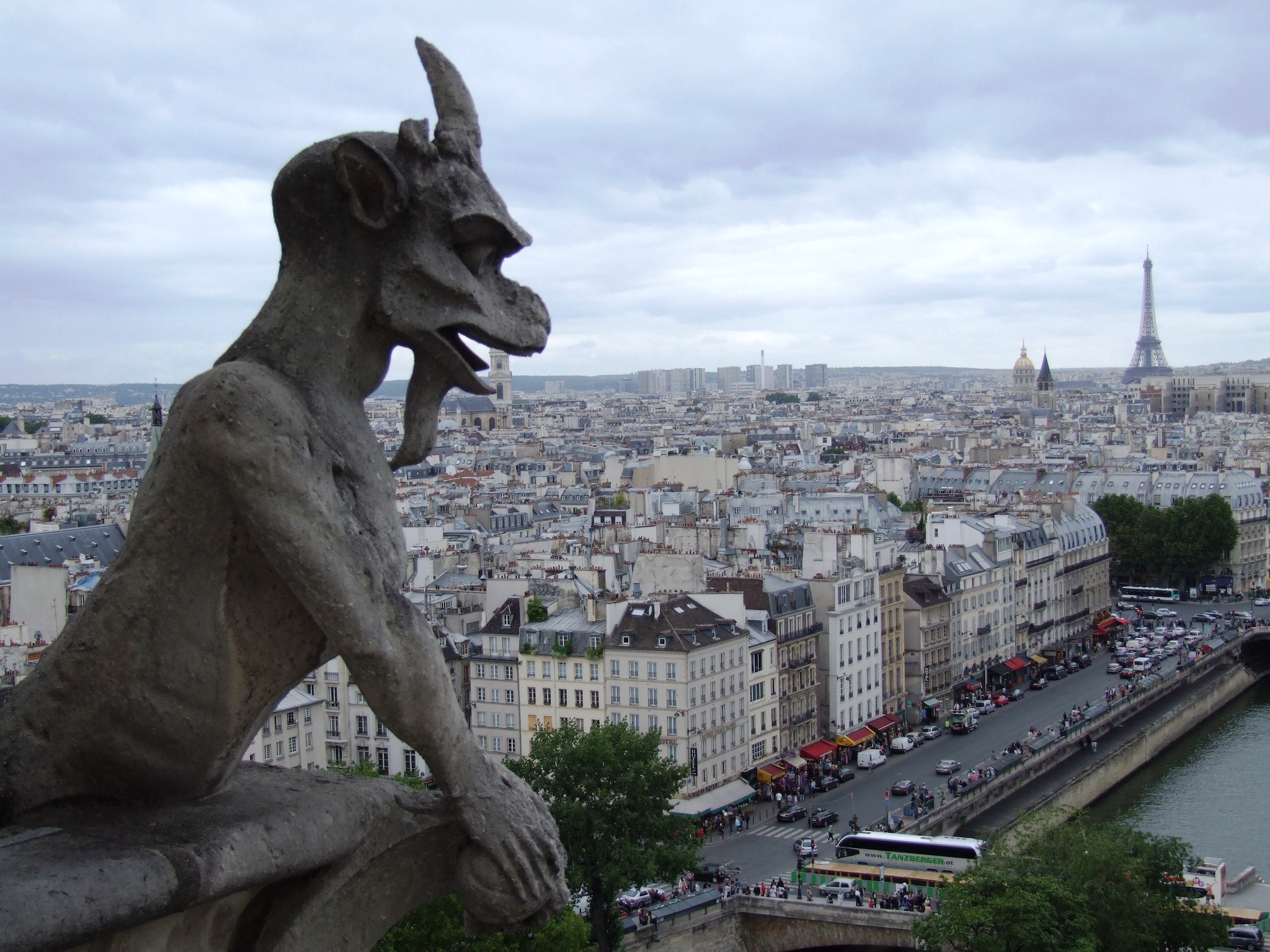 Devil gargoyle overlooking Paris and Eiffel Tower